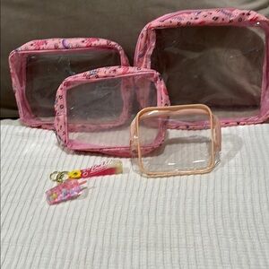 Four clear storage bags and a keychain